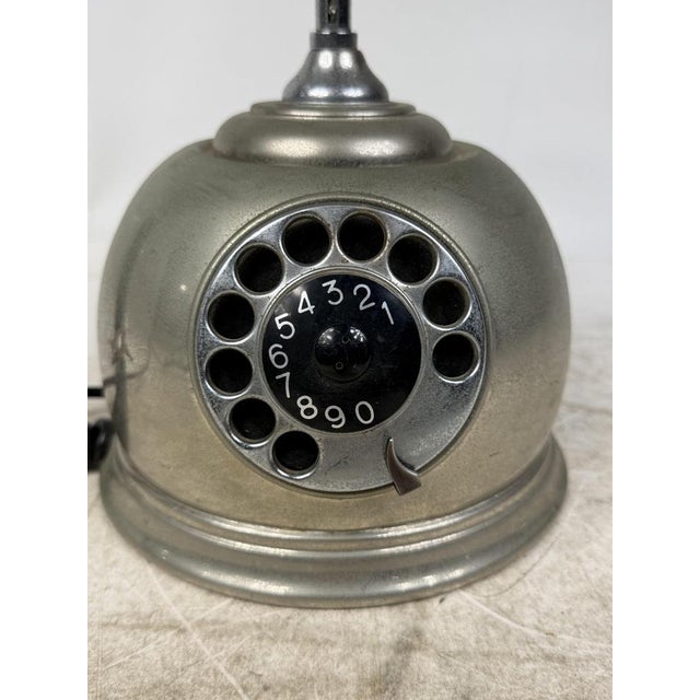 Beautiful vintage chrome-plated rotary phone. Ideal for adding a touch of retro elegance to any home or office.