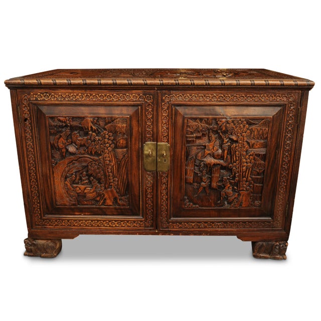 An exquisite carved chinese export two door camphor chest with etched brass lock fitted with a removable glass top. open...