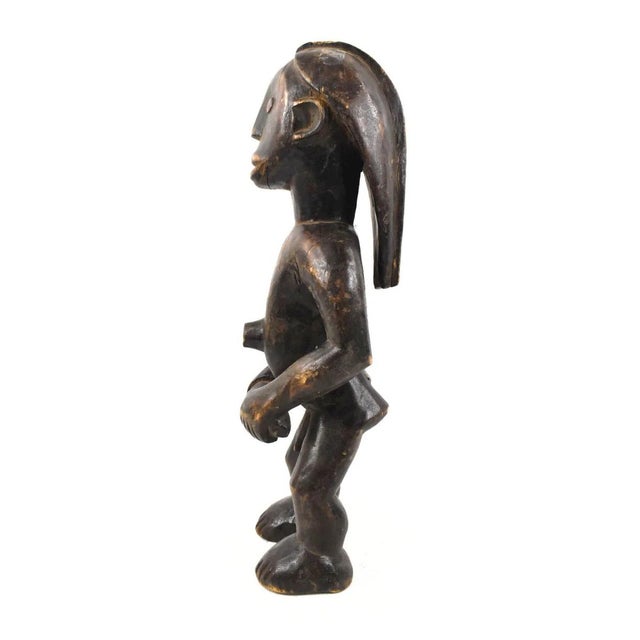Delve into the captivating world of Congolese artistry with our stunning Tabwa Miniature Figure, standing tall at 18...