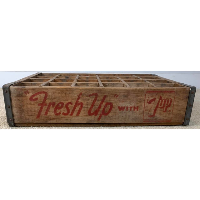 Vintage 7-Up wooden bottle crate featuring the classic red "Fresh Up with 7Up" advertising slogan and metal-reinforced...