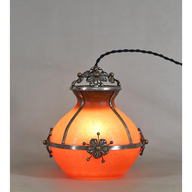 E. Val et Cie. A French 1920-1930 art deco night lamp in bohemian glass and silver plated brass. E. Val was a silversmith...