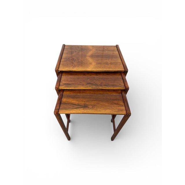 This elegant set of Mid-Century Modern rosewood nesting tables showcases the clean lines, rich tones, and functional...