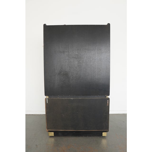 This vintage 1970s Hollywood Regency china cabinet by Milo Baughman is a striking example of the era’s bold sophistication...