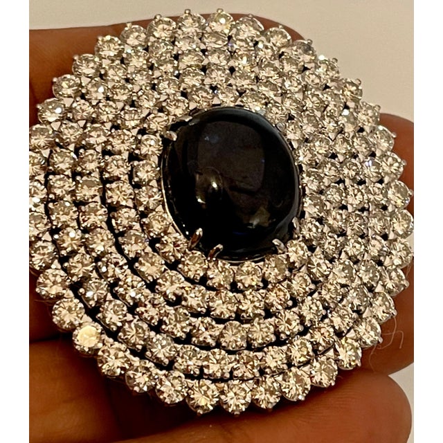 GIA Certified 18.41 Ct Sapphire & 21 Ct Diamond VVS/E-F Color Pin Set in 18 Karat white gold Sapphire Cabochon 18.41 ct...