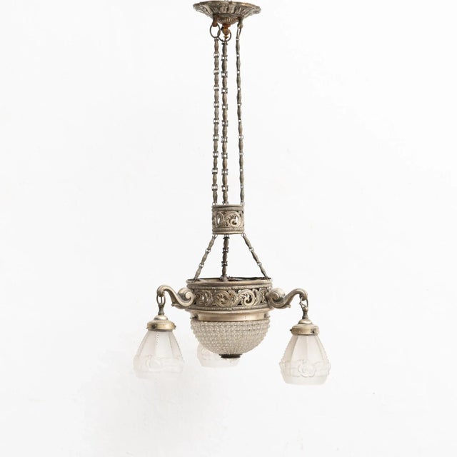 French vintage metal and glass Art Deco hanging lamp. By unknown manufacturer from France, circa 1930. In original...