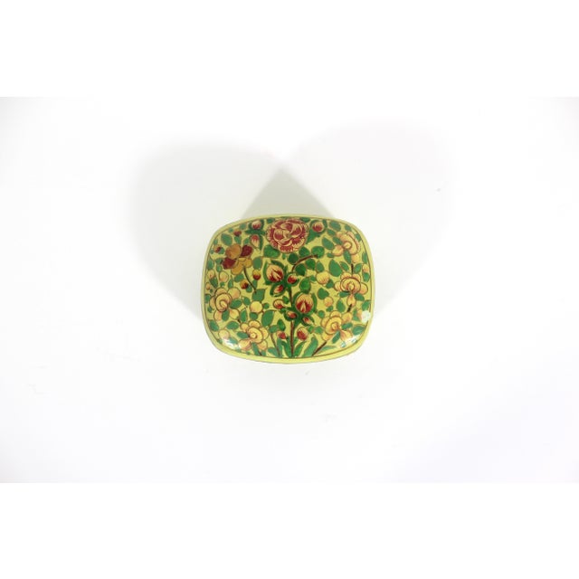 Beautiful vintage Kashmir lidded trinket box made from papier maché, hand painted and then lacquered. This has a floral...