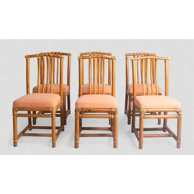 This refined set of 6 vintage bamboo chairs adds an exotic and retro touch to any space, ideal for both dining rooms and...