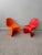 Pair of Vitra Verner Panton S Junior Chairs, produced in 2005 (red) and 2009 (orange). These playful seats reinterpret one...