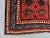 This authentic antique Turkish hand-knotted rug features a striking Caucasian tribal design with bold red as the dominant...