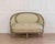 This elegant canapé corbeille exemplifies the refined comfort and graceful proportions of Louis XVI–style seating. The...