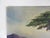 Early 20th century oil on canvas board painting of a seaside landscape with lone tree and mountains. Unsigned. Unframed,...