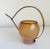 Late 20th century Italian-made watering can with a blown glass body, copper handle and spout, and rattan wrapped handle....