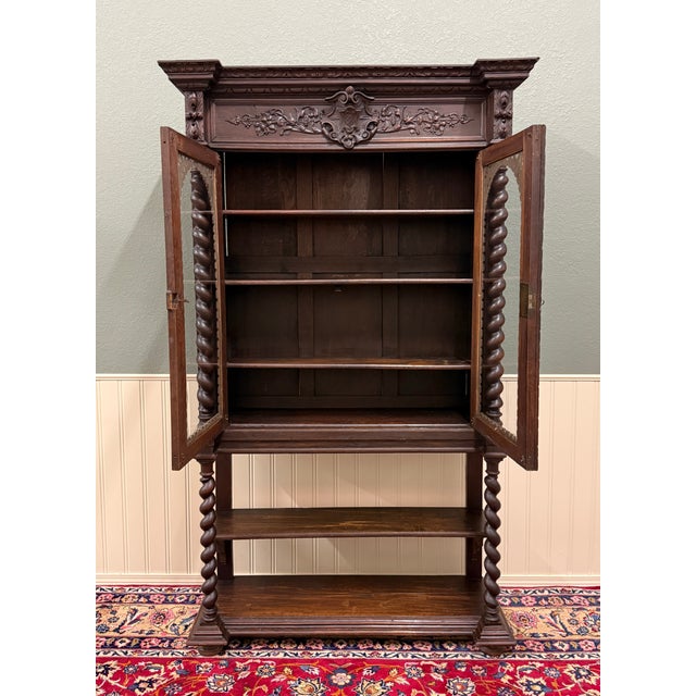 Beautifully Carved Antique French Louis XIII Style Oak Barley Twist Bookcase on Two-Tier Stand c. 1880s Exquisitely carved...