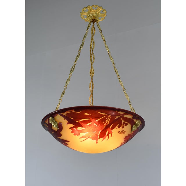 établissement Émile Gallé A wonderful French art deco hanging fixture in gild bronze with a large Gallé bowl in acid-...