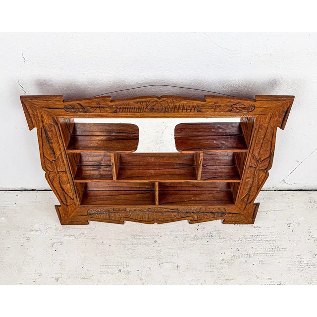 A mid-century modern mirrored shadow box with handsome detailing and shape. It’s a mightily unique piece that’s giving...