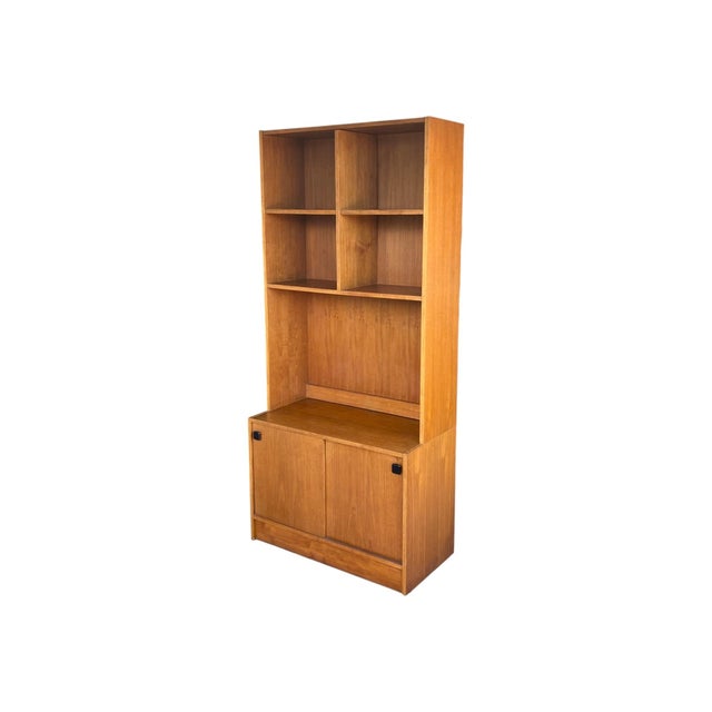 This refined 1960s Danish Modern bookcase is expertly crafted from teak fully restored and newly lacquered and finished in...