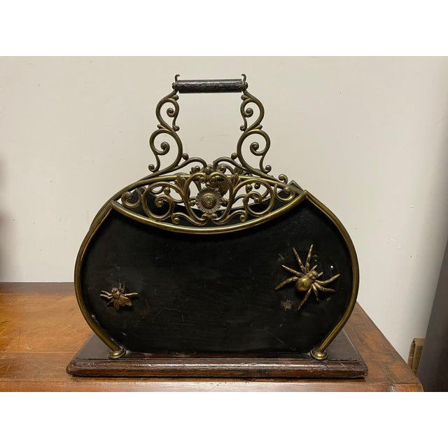 Fun and whimsical Victorian magazine rack black patinated sheet steel famed in brass with brass spider and flies attached....