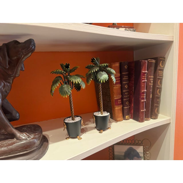 A pair of tole palm trees in jardinieres-decorative sculptures for your bookcase or table top. Lovely details include...