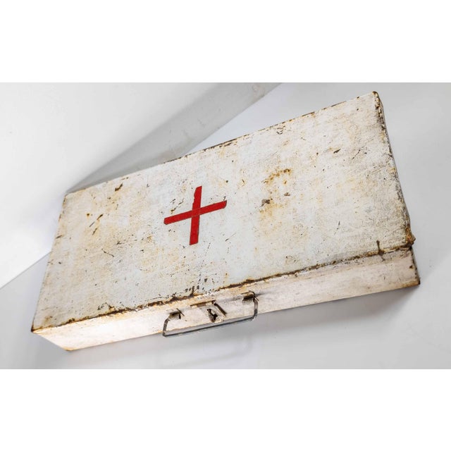 We are selling this nice looking distressed white painted metal box or first aid kit with old tape red cross. Probably 1st...