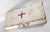 We are selling this nice looking distressed white painted metal box or first aid kit with old tape red cross. Probably 1st...