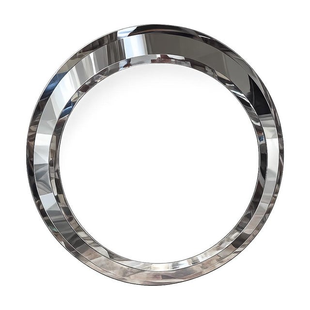 A striking Italian Modern / Fontana Arte–style round mirror dating to 1981, featuring an elegant layered beveled design...