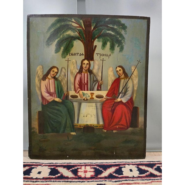 Presenting a magnificent 19th-century Orthodox icon depicting The Old testament trinity. This piece is painted in tempera...