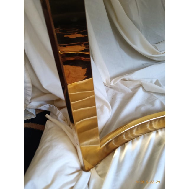 Vintage curved brass and marble modern coffee table. Rectangular top shape. 48 in long, 25 in wide, and 19in high. The...