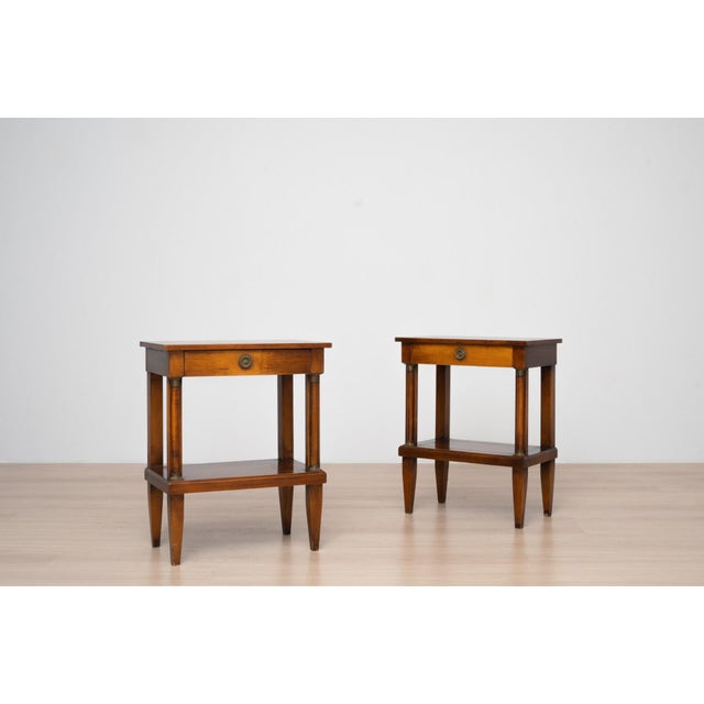 An elegant pair of side tables dating from the second half of the 20th century, designed in the classical Empire /...