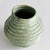 With a reactive glaze and hand finished ribbing detail, this charming sage green vase is a great find. Add a few faux...