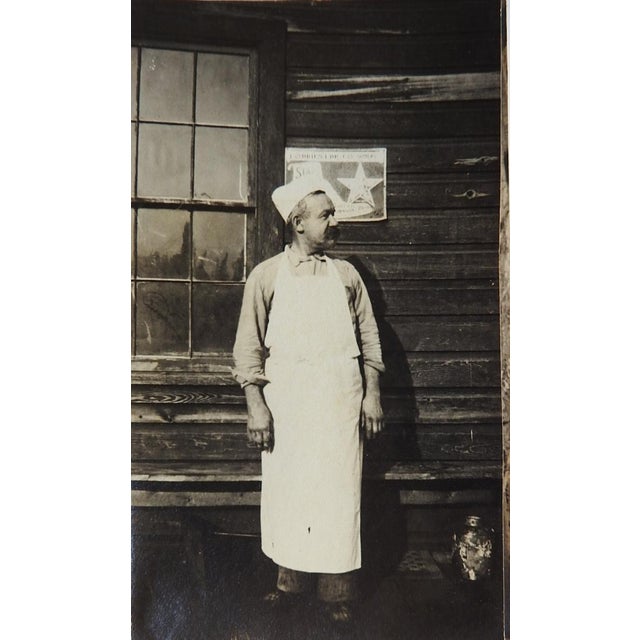 Early 20th century pair of silver gelatin snapshot photographs of a cook and logging crew loaded up on a skeleton railroad...
