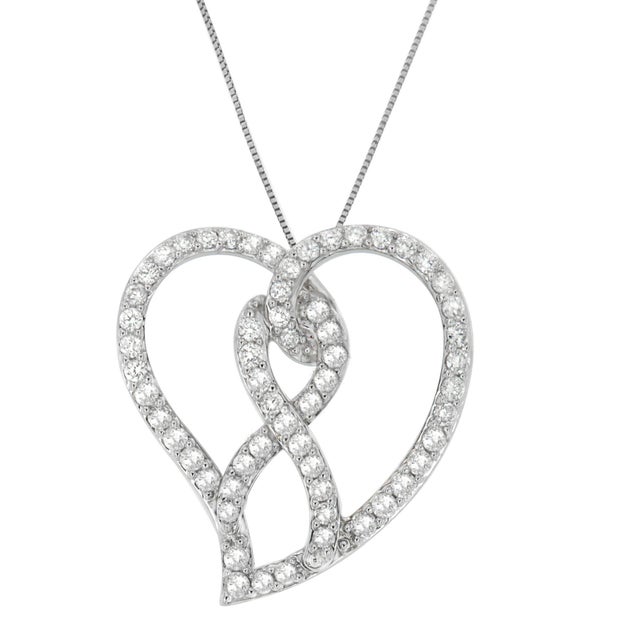 Celebrate a loved one's life with this stunning diamond pendant. Designed in the shape of a heart, and featuring bow...