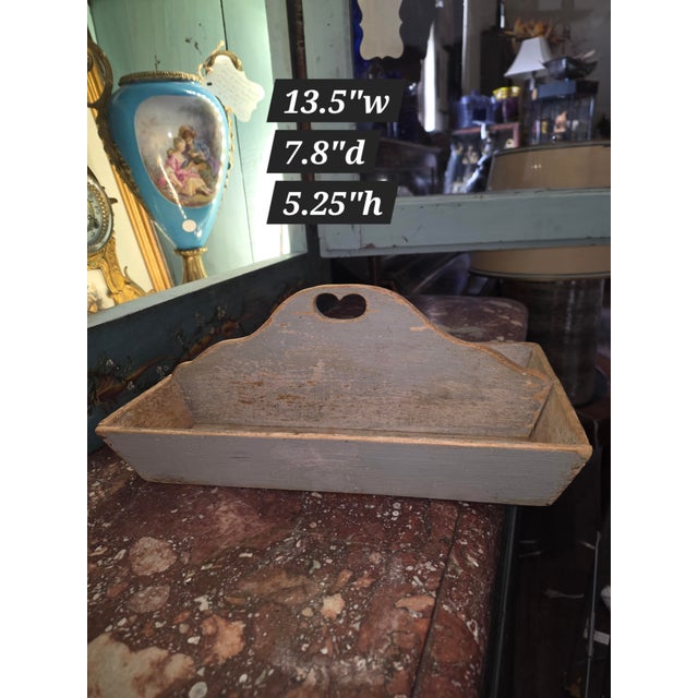 Great antique American pine caddy with pale gray worn painted surfaces. This has a cut out handle with a heart like shape...