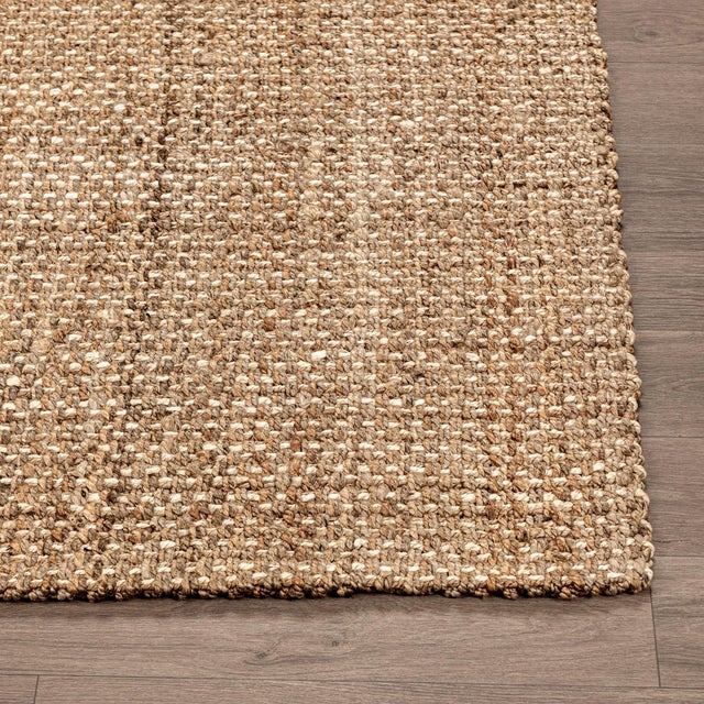 Hand spun and braided jute rug in a natural subtle stripe design. Available in numerous sizes. Please note that its...