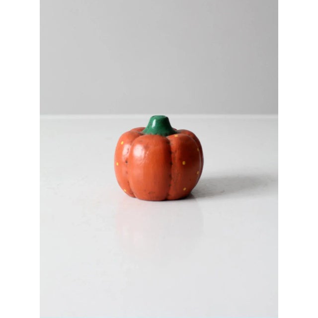 This is a vintage ceramic pumpkin. Hand-painted, the orange pumpkin has a sprinkling of yellow polka dots and a green...