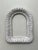 Natural hand woven rattan craftmanship along with the frame's feminine curved arched silhouette comprises this vintage...