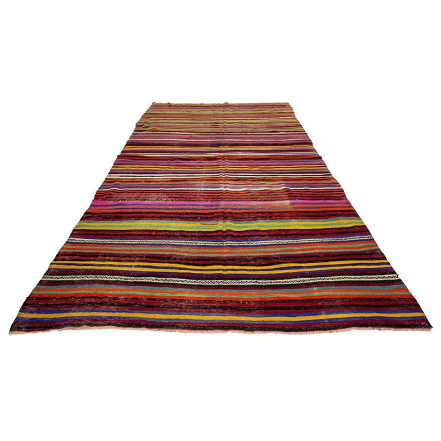 Colorful striped vintage kilim rug from Denizli region of Turkey. Approximately 45-55 years old. ın very good condition