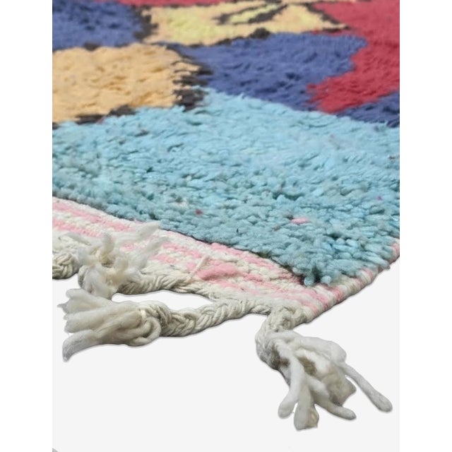 Tribal Moroccan Rug – Handmade Abstract Berber Wool Rug This striking handmade Moroccan rug features a rich abstract...