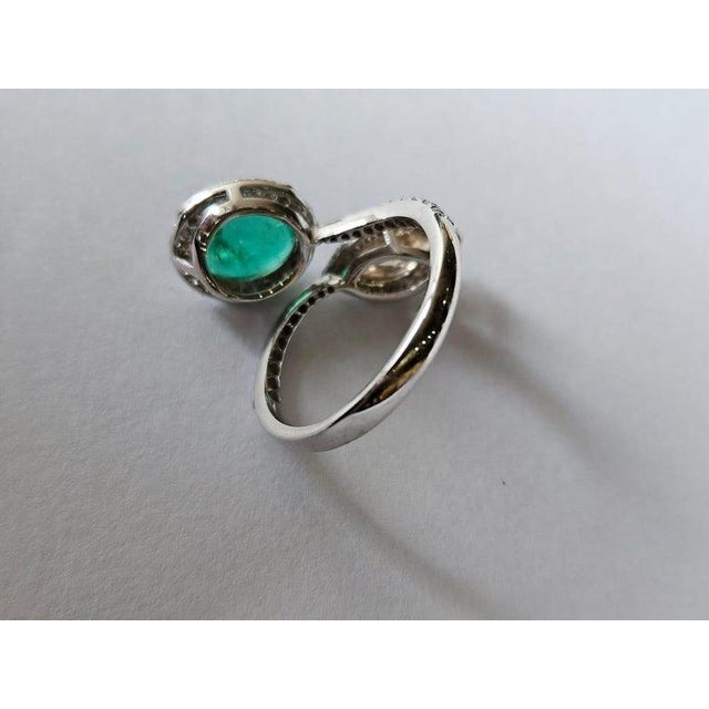 A very gorgeous and beautiful, Emerald Engagement Ring set in 18K White Gold & natural Diamonds. The weight of the Emerald...