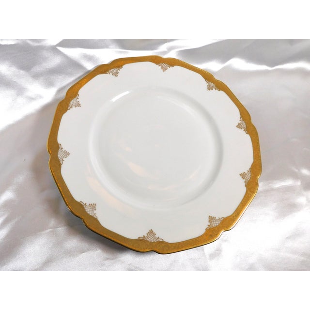 This is a white dinner plate by Heinrich & Co. in HC611. It has gold trim and a gold encrusted shaped rim. I have three...