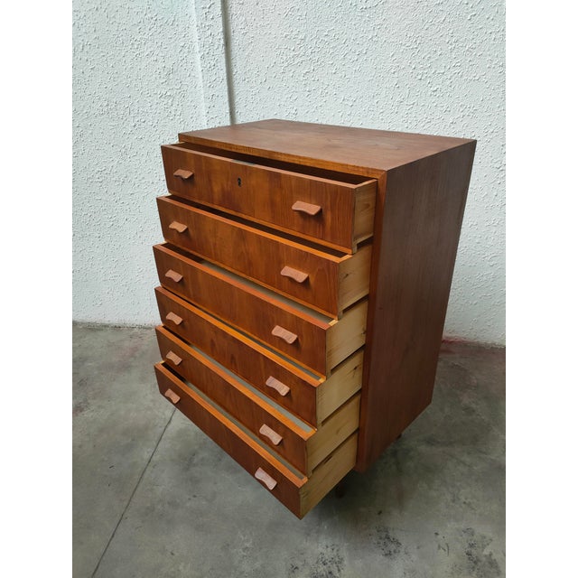 Classic mid-century teak chest of drawers with six drawers from a Danish manufacturer, dating from the 1960s. This...