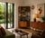 Avalon modular corner shelving unit featuring teak veneers and a black-coated metal frame. The modular design allows the...