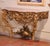 Place this elegant antique console table against a wall in an entry, hallway, or salon for a striking statement of early...