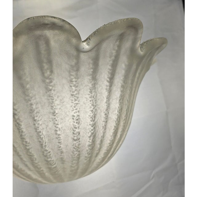 Beautiful pair of vintage tulip-form glass wall sconces with frosted exteriors and textured ribbed/pulegoso-style...