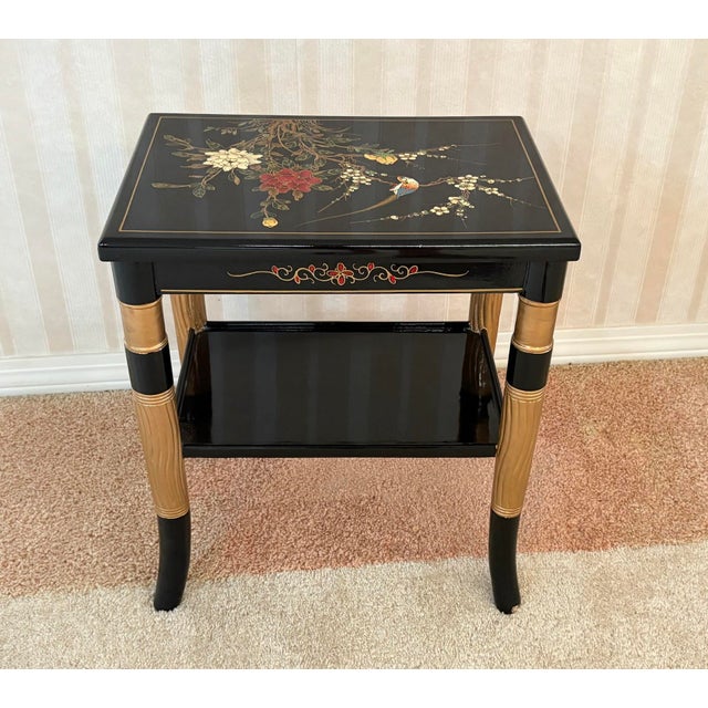 1970s-80s black/gold lacquered asian-style side table w/ bird/flower detail. Excellent condition.