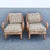 A distinctive pair of vintage mid-century modern lounge chairs attributed to Heywood-Wakefield, featuring sculptural...