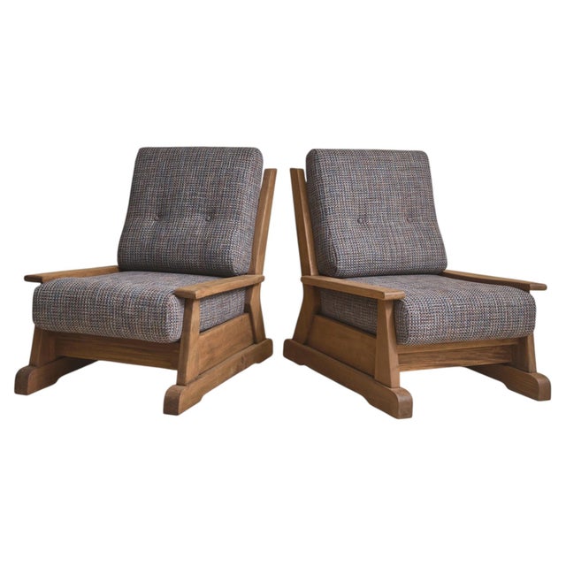 Crafted from richly grained elm, this 1960s French armchair is defined by its architectural frame and low, grounded...
