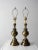 This is a pair of mid 20th century brass table lamps. The baluster style lamps have modern design flourishes and sleek...