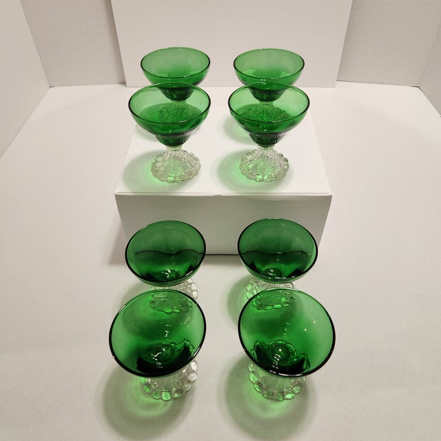 Elevate your holiday table setting or bar cart with this striking set of eight mid-century modern champagne coupes/...