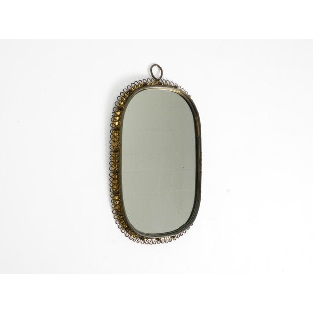 Beautiful heavy mid-century modern brass wall mirror by Josef Frank for Svenskt Tenn. Made in Sweden. Minimalist 1950s...
