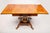 A wonderful Biedermeier-style drop-leaf table with a spectacular crotch mahogany top banded with Karelian birch and with...